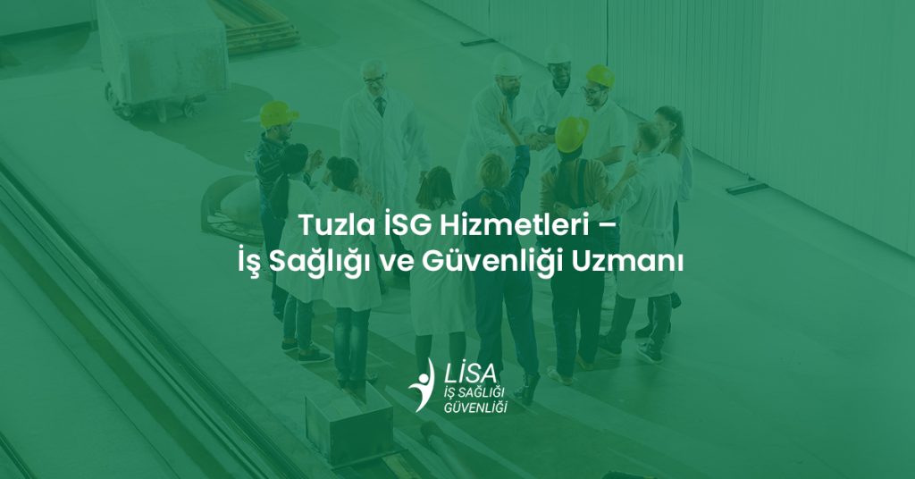 Tuzla sanayi bölgesinde iş sağlığı ve güvenliği eğitimi alan baretli ve önlüklü teknik personel grubu.